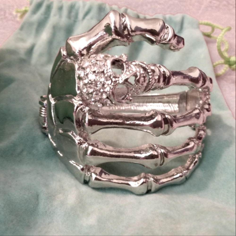 Skeleton Hand Cuff Bracelet with jeweled Skull ring and jeweled heart at closure